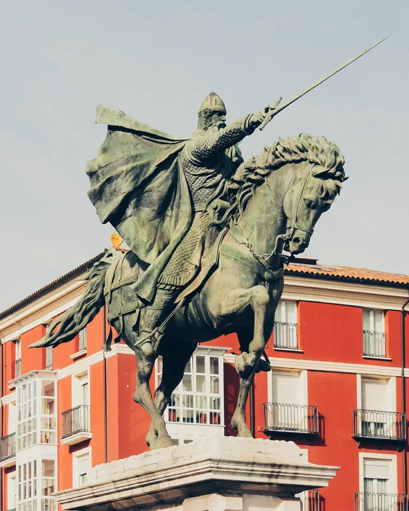Closeup shot o a statue of a male holding a sword and sitting on a horse during the spanish reconquista