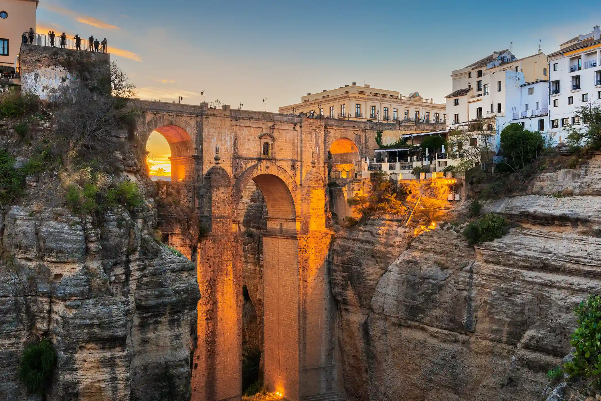 Photo of the Puente Nuevo at sunset from the Cuenca Gardens in Ronda